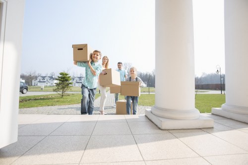 Packed boxes and furniture ready for local removals in Holland Park
