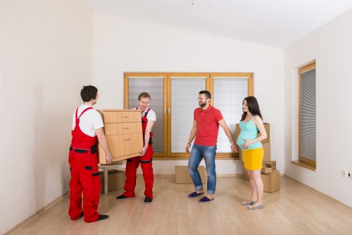 Moving truck service planning a residential move in Holland Park