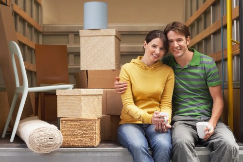 Moving van loading household items for a West London property